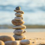 Pebble tower balance harmony stones over the beach