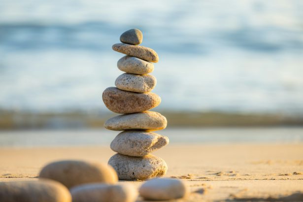 Pebble tower balance harmony stones over the beach